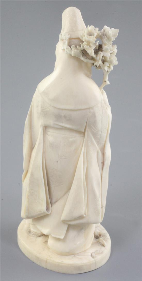 A Japanese ivory okimono of priest and a child, Meiji period,